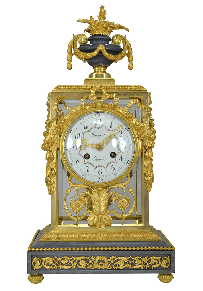 Pendule cage en bronze et verre signé "Bouquet Paris" Louis XVI