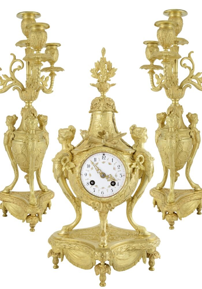 Pendule et chandeliers "cariatide" Horloger: Mougin